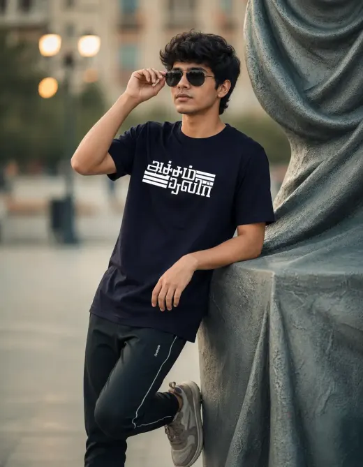Unisex navy blue cotton-stretch t-shirt with 'Acham Thavir' Tamil typography on the chest