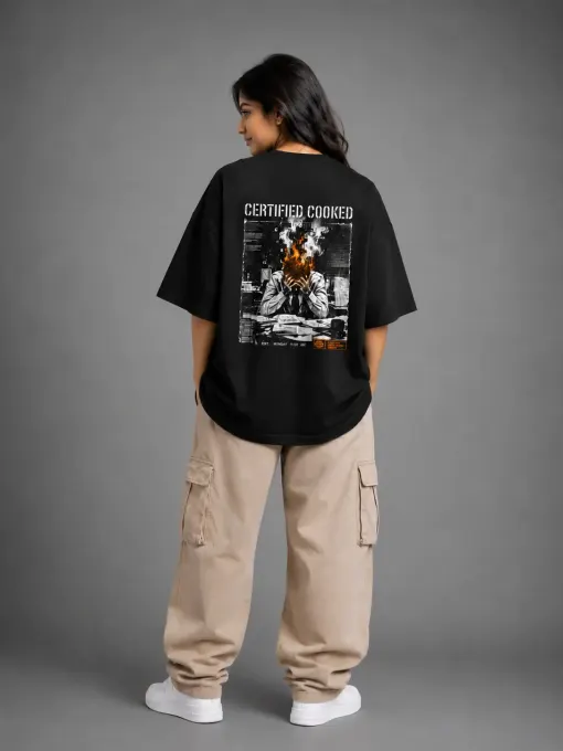 Black oversized t-shirt with bold 'Certified Cooked' back print and relaxed silhouette