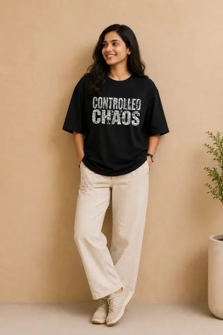 Controlled Chaos black oversized t-shirt — clean front view