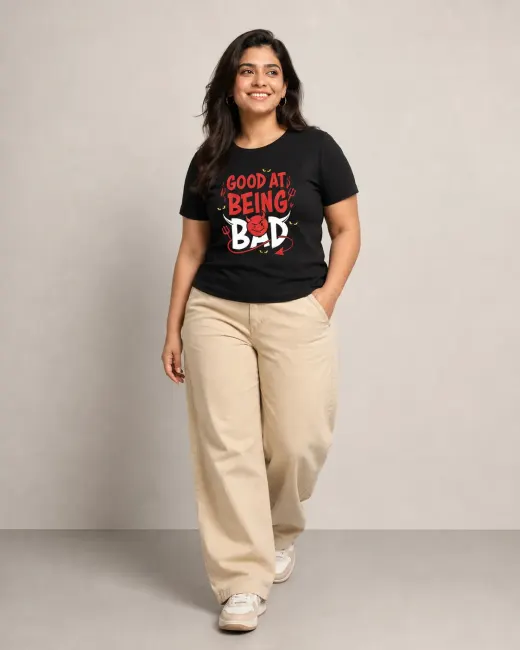 Good At Being Bad unisex regular-fit black t-shirt, front view on neutral background showing chest print and relaxed silhouette