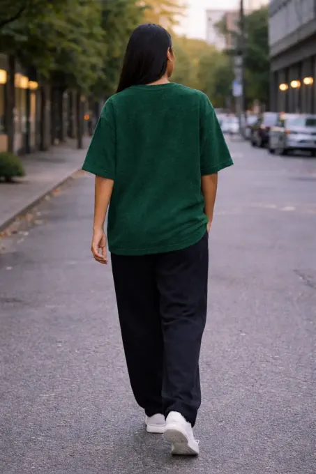 green terry oversize t-shirt on neutral background, premium cotton texture visible