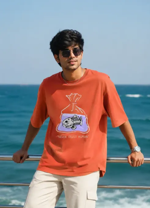 Model wearing the 'Never Trust Human' oversized graphic t-shirt with front print, relaxed fit styled for streetwear