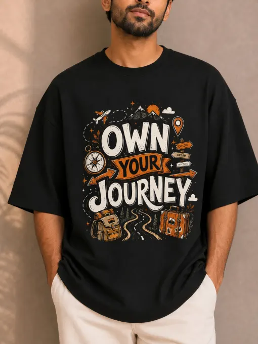 Black oversized t-shirt with 'Own Your Journey' front graphic, relaxed streetwear fit