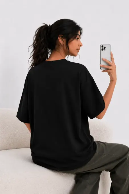 Perspective oversized graphic t-shirt, front view on plain background, relaxed fit and bold chest artwork