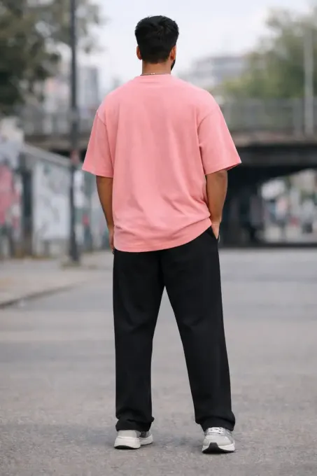 Pink terry oversize t-shirt, front view showing relaxed fit and crew neckline
