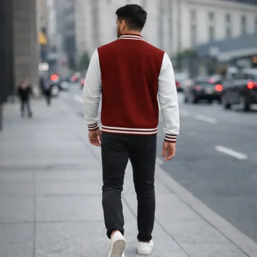 Red and white unisex varsity jacket with striped ribbed collar and button-front closure
