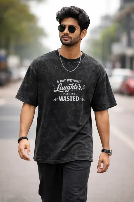 Unisex oversize acid-washed T-shirt featuring a front Charlie Chaplin graphic