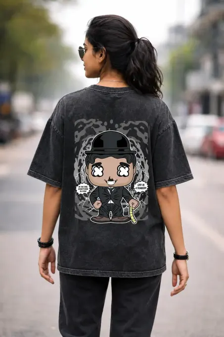 Unisex oversize acid-washed T-shirt featuring a Charlie Chaplin graphic, relaxed dropped-shoulder fit