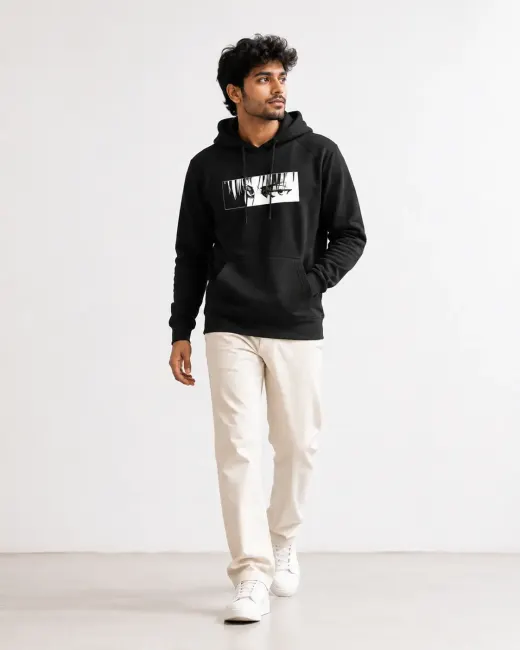 Black pullover hoodie with stylized anime eyes graphic on the chest