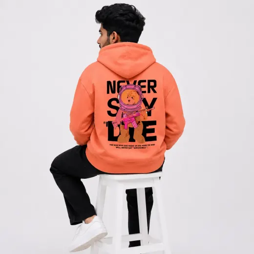 Never Say Die coral pullover hoodie on a plain background
