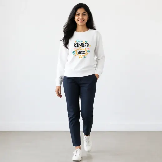 Unisex oversized sweatshirt featuring a 'Kinder Vibes' front graphic