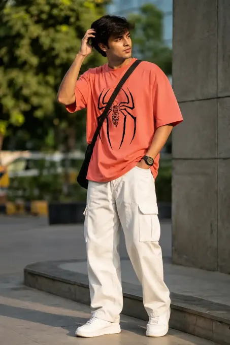 Oversized t-shirt featuring a prominent spider graphic with the word ‘Responsibility’, styled in a streetwear fit.