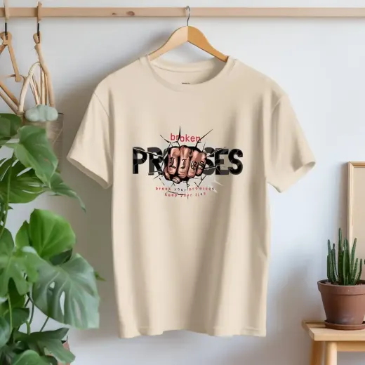 Unisex "Broken Promises" graphic crew-neck t-shirt with bold front print, classic fit and short sleeves.