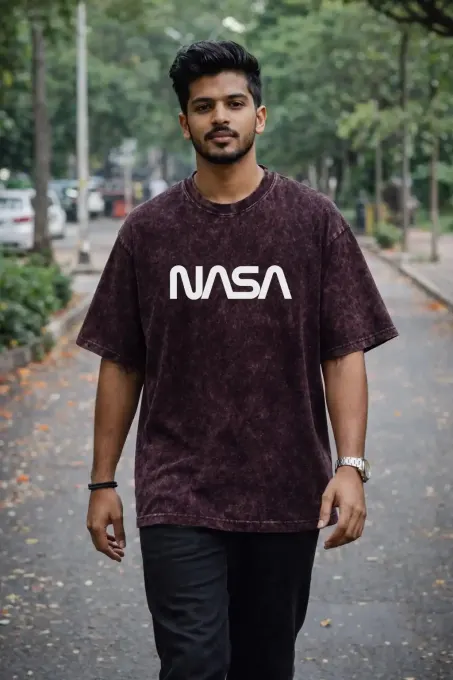 Unisex oversize acid-washed t-shirt featuring a NASA astronaut graphic with relaxed fit