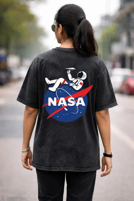 Unisex oversize acid-washed t-shirt featuring a NASA astronaut graphic