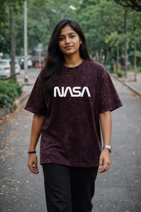 Unisex oversize acid-washed T-shirt featuring a NASA astronaut graphic and relaxed silhouette