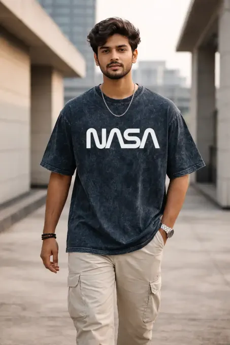Unisex oversize acid-washed T-shirt featuring a NASA astronaut graphic with a relaxed, streetwear fit