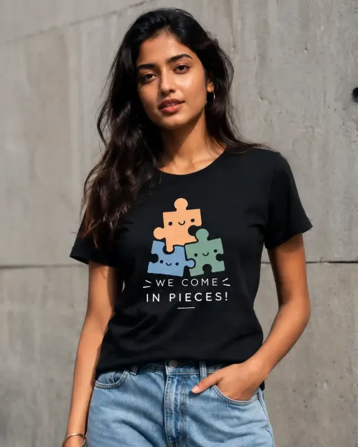 'We Come In Pieces' graphic Supima cotton oversized t-shirt laid flat on neutral background